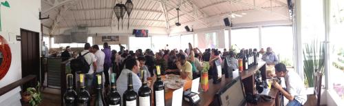 a group of people standing in a room with their hands up at Sky Club Eco Hotel in Belén de Umbría