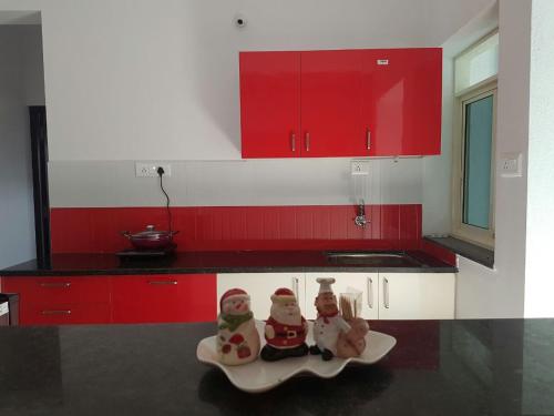 two santa claus figurines on a plate in a kitchen at Ocean Shores Hospitality in Candolim