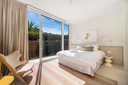 a bedroom with a bed and a large window at Lucia Sorrento in Sorrento