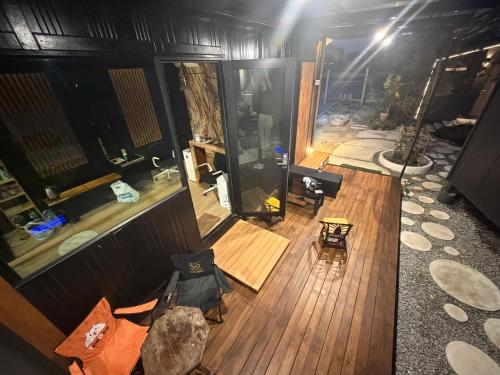 an overhead view of a house with a wooden floor at ของขวัญรีสอร์ท in Ban Khlong Ai Kok