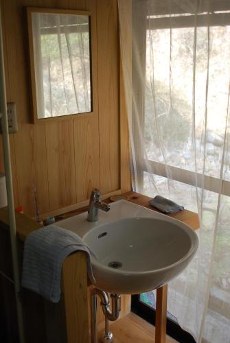 a bathroom with a sink and a window at Goemon Kyoto Japan in Kyoto