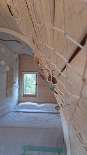 a small room with a bed in a house at Su Niberalzu glamping in Fermata di Enas