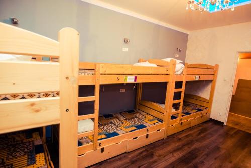 a room with two bunk beds in a room at Greg&Tom Beer House Hostel in Krakow