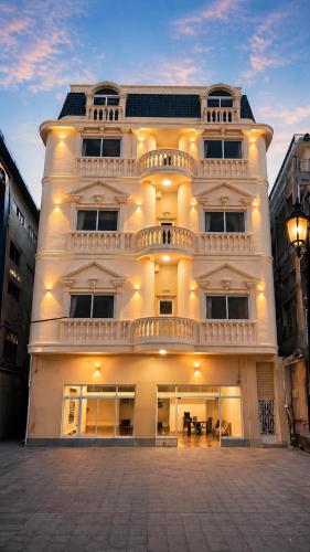 a large white building with a lot of windows at A Z Hotel Phnom Penh in Phnom Penh