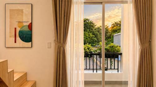 a room with a window with a view at Amory Airport Hotel in Ho Chi Minh City