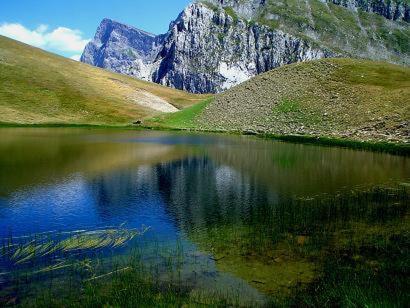 a reflection of a mountain in a body of water at Archontiko Geki 1876 in Papigko