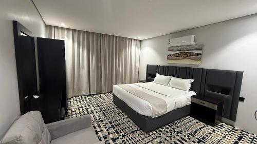 a bedroom with a bed in a room at Qimam Park Abha 4 in Abha
