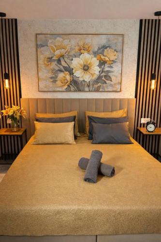 a bed with two mitts on top of it at Las Americas Prime Suite Spot in Costa de Adeje