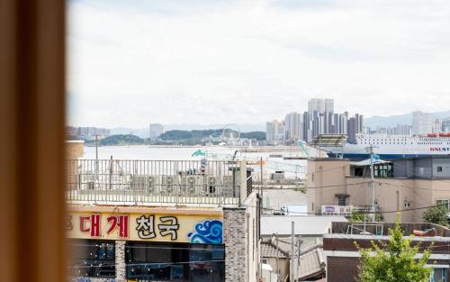 a view of a city from a window at Mo-A Motel in Sokcho