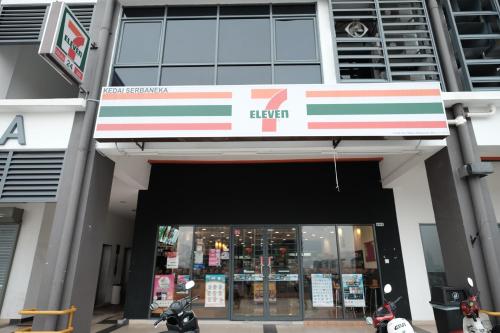 a store front with a red white and blue sign at B Lot Hotel in Kuala Lumpur