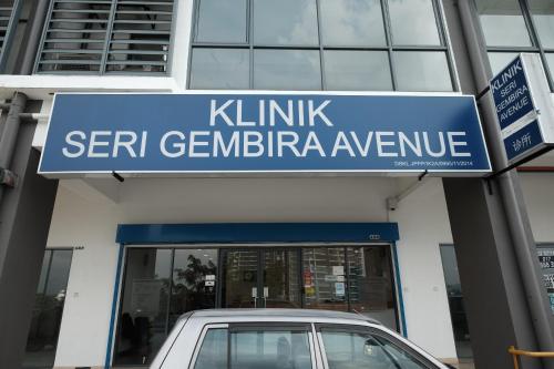 a car parked in front of a ker germination manoeuvre sign at B Lot Hotel in Kuala Lumpur