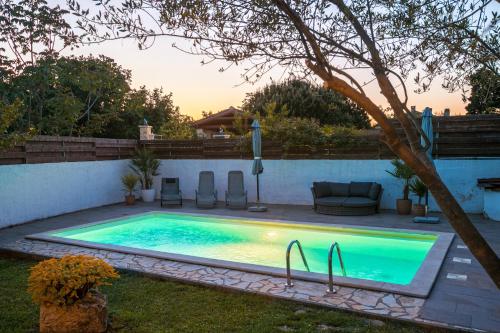 a swimming pool in the backyard of a house at Stonehouse Ewa&Pool in Medulin