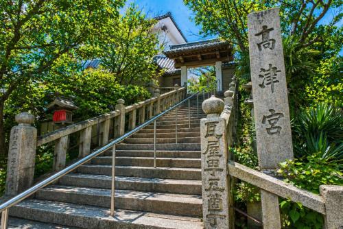 a set of stairs in front of a house at Doutonbori Crystal Exe in Osaka