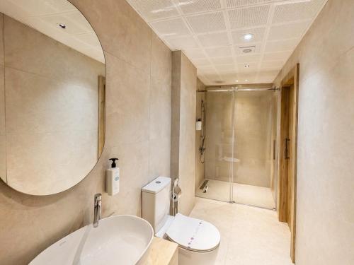 a bathroom with a sink and a toilet and a shower at Studio Miscela in Urla