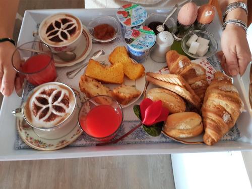 a tray of breakfast foods and coffee on a table at Al Villino del Sole in Fano