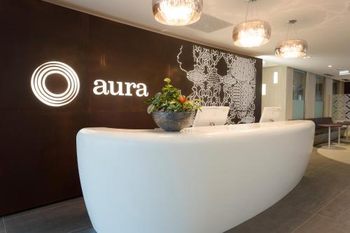 a white counter with a potted plant on top of it at Aura Hotel Adults Only in Balatonfüred