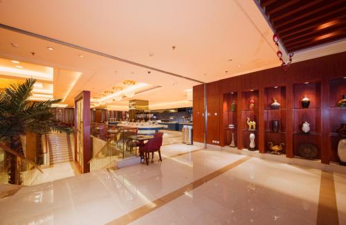 a large room with a kitchen and a dining room at Shu Guang International Hotel in Nanjing