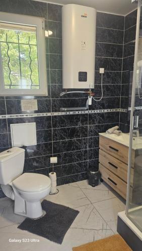 a bathroom with a toilet and a sink at Zen et cosy in Marseille