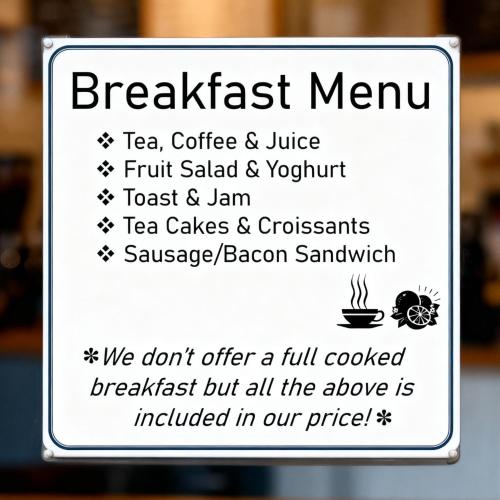 a sign for a breakfast menu in a restaurant at West End Guest House in Richmond