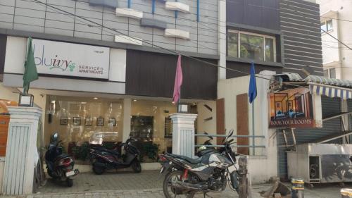 a group of motorcycles parked in front of a store at Hotel Blu Ivy in Chennai