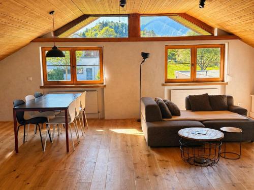 a living room with a couch and a table at Garage Loft in Satteins