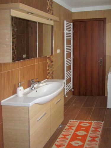 a bathroom with a sink and a mirror at Filomeni's house in Kavála