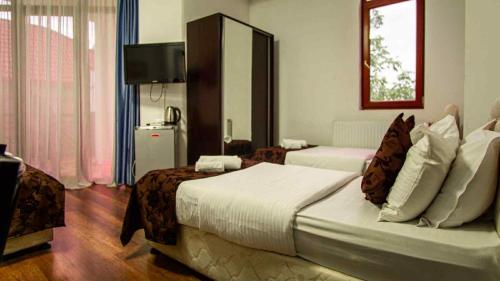 Postelja oz. postelje v sobi nastanitve Hotel NBL Inn