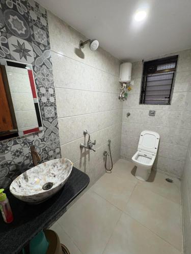 a bathroom with a sink and a toilet at Green Valley Resort in Thāl
