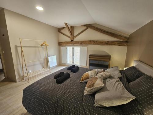 a bedroom with a large bed in a room at Villa nest in Saint-Sauvant