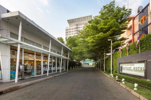 an empty street in a city with buildings at Kantary Hotel Kabinburi in Kabin Buri