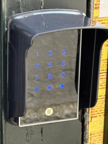 a close up of a cell phone with blue buttons at Historic Centre Hotel in Amsterdam