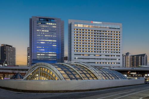 a building in a city with tall buildings at Kobe Marriott Hotel in Kobe
