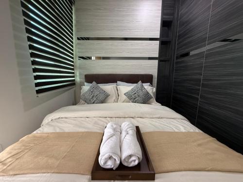 a bed with two pairs of white towels on it at SPICE Skyview Luxe Tunas 3B2B in Relau