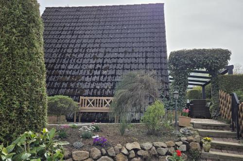 a building with a garden in front of it at Haus Rosengarten 2 in Bad Wünnenberg
