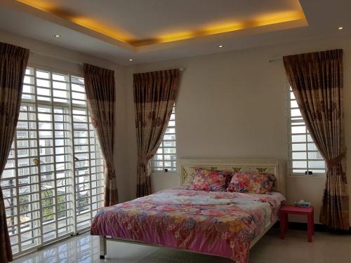 Ένα ή περισσότερα κρεβάτια σε δωμάτιο στο Borey Villa Toulsangke
