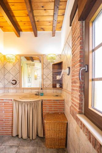 a bathroom with a sink and a mirror at La Helguera By Silastur in Colombres