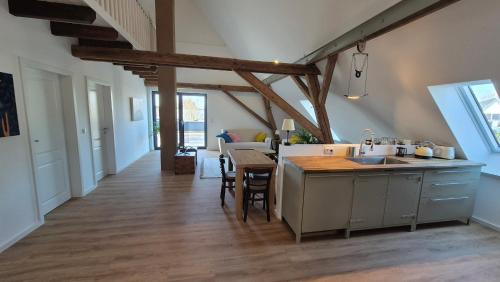 a kitchen with a table and a counter top at Ferienwohnung Melle - Westerhausen in Melle