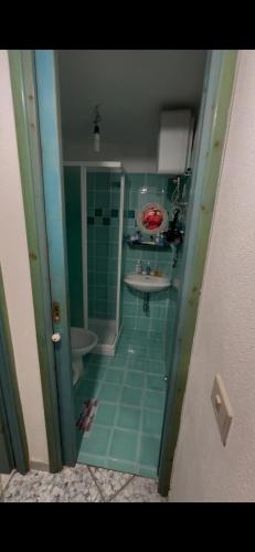 a bathroom with a shower and a sink and a tub at Casa Ady in San Teodoro