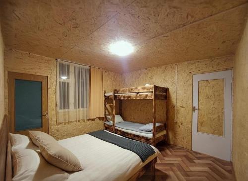 a small bedroom with a bunk bed in it at Camping Three poplars by VL in Alaverdi
