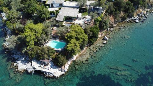 an aerial view of a house on a island in the water at Villa Mitzela in Amaliapoli