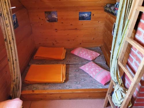 an inside of a sauna with two beds in it at Zavetišče pod Špičko in Soča