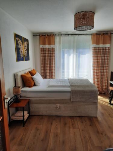 a bedroom with a large bed in front of a window at Augsburg!Möblierte Appartment! in Augsburg