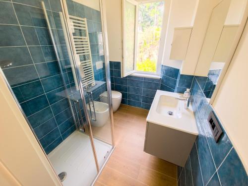 a bathroom with a shower and a sink and a toilet at Noli Blue Bay in Noli
