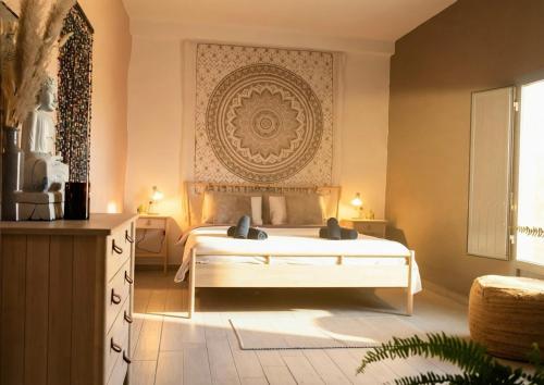 a bedroom with a white bed with a large headboard at Boutique Cortijo Meliora in Cantoria