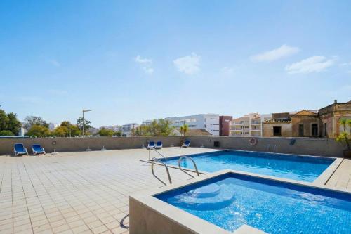 Loreto Top Floor Lagos Center Condo with Indoor Pool