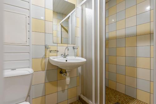 a bathroom with a toilet and a sink at Velga in Vilnius