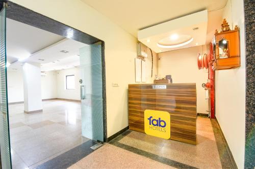 an office lobby with a job sign on the door at FabHotel The Fortune in New Delhi