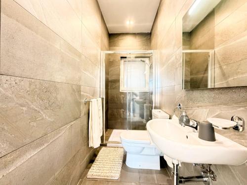 a bathroom with a sink and a toilet at St Julians - Spinola Space by DNA in St. Julianʼs