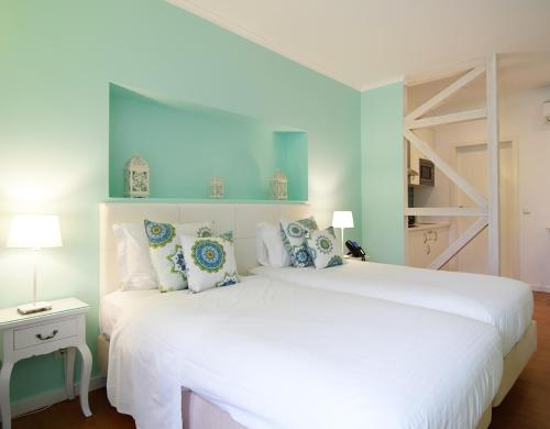 Cama o camas de una habitación en Rossio Apartments