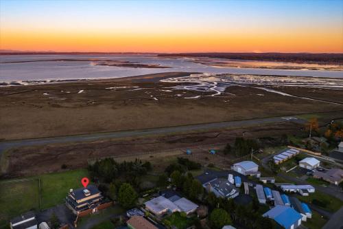 an aerial view of a house and the ocean at Spacious Gracious & Luxurious Retreat in Westport